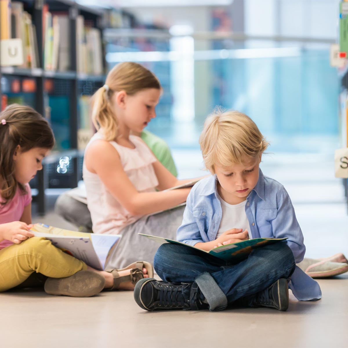 Children in library reading
