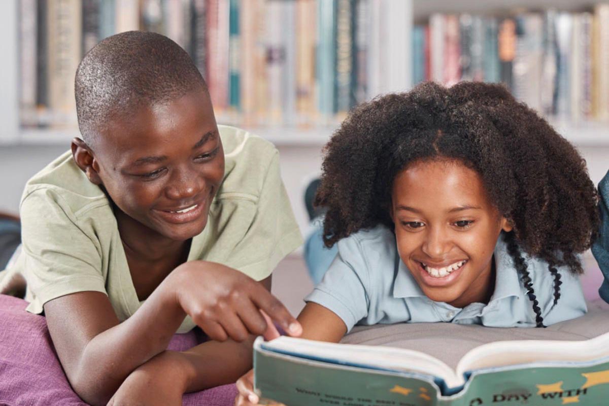 Children in library reading 